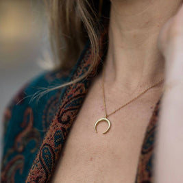 Small brass crescent necklace