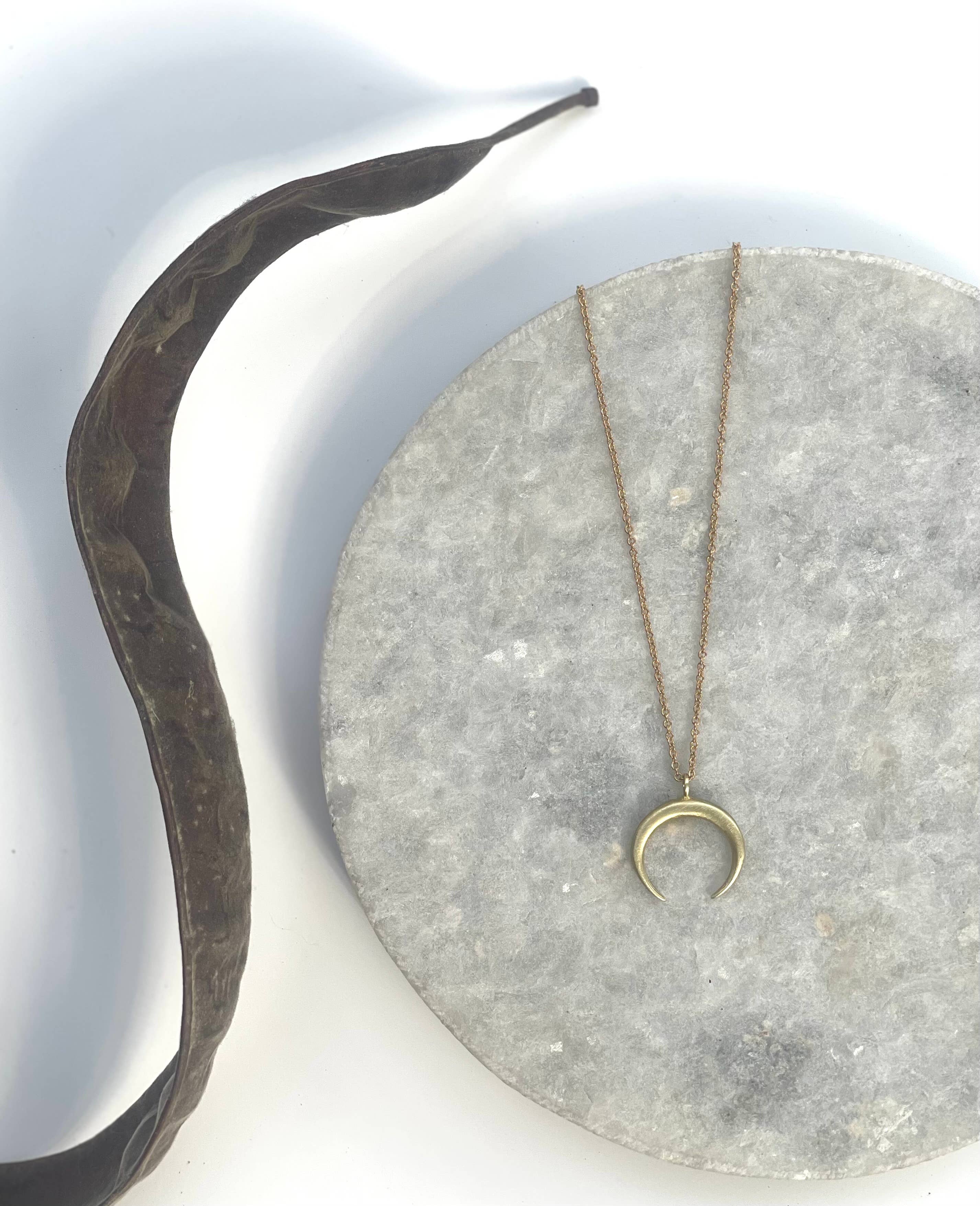 Small brass crescent necklace