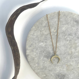 Small brass crescent necklace