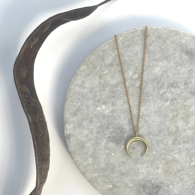 Small brass crescent necklace